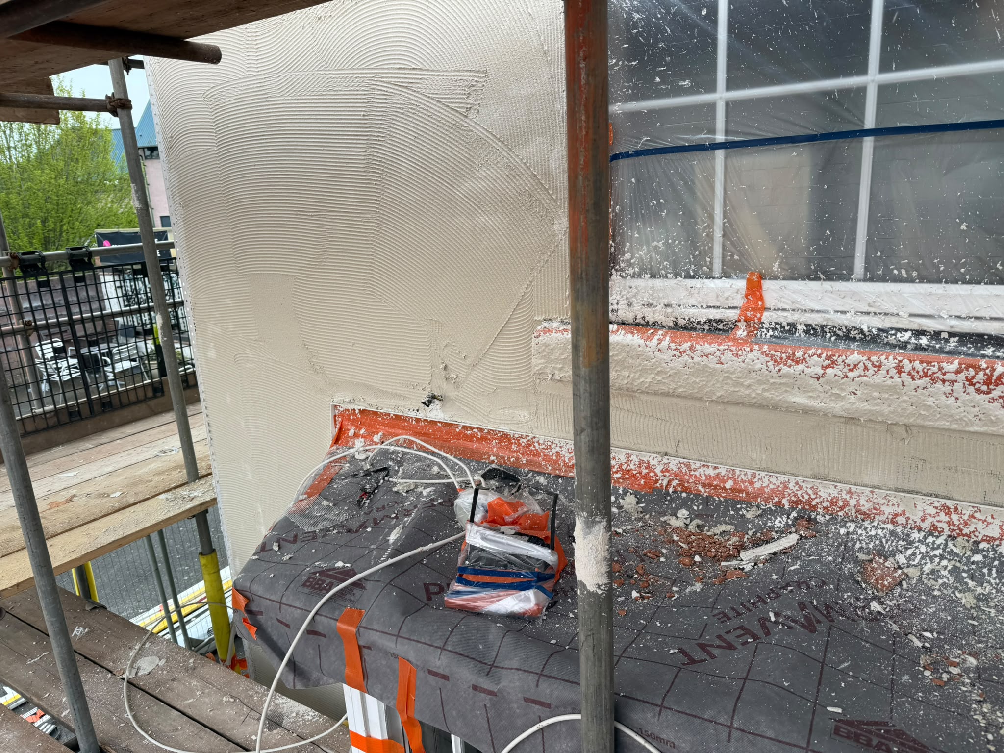 Large multi-unit residential block with monocouche render