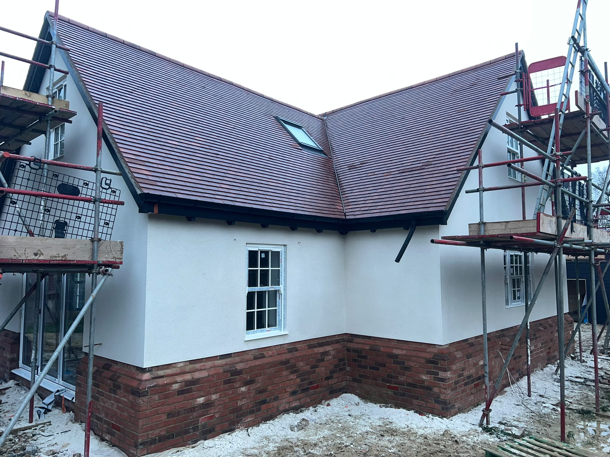Yellow basecoat with embedded mesh during EWI installation